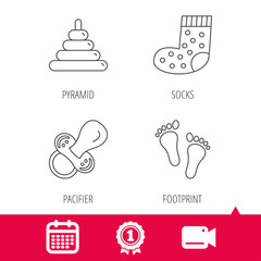 Achievement and video cam signs. Footprint, pacifier and socks icons. Pyramid toy linear sign. Calendar icon. Vector