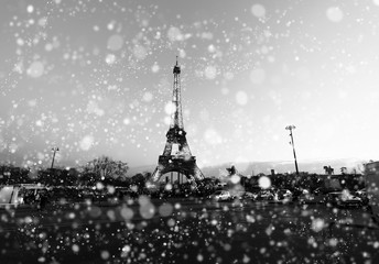 Paris cityscape with Eiffel tower at winter night in France. Vintage black and white soft focus...