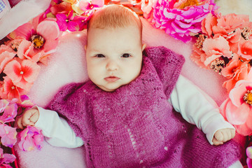 Fototapeta premium Incredible and charming newborn baby lying in floral basket