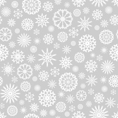 Seamless Christmas background with white snowflakes. Template from snowflakes for your Christmas design.