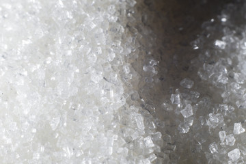 White sugar scattered on the table.