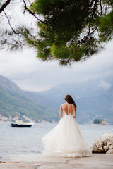 unidentified bride walking in picturesque bay