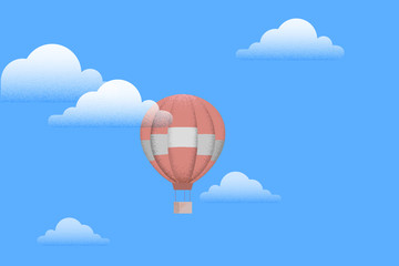 Hot air balloon with white clouds on blue sky
