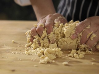 kneading dough on table
