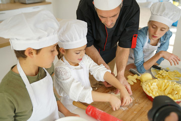 Pastry class with kids little chefs © goodluz