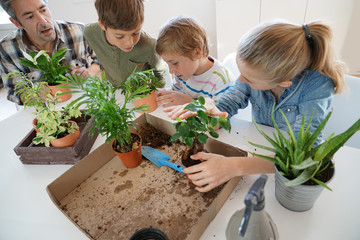 Teacher with kids in biology class learning about plants