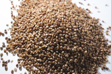 Buckwheat is scattered on the table.