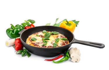 Freshly baked pizza in a pan on white background