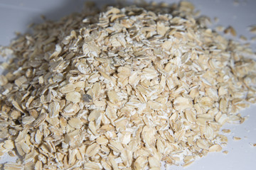 Oats scattered on the table. Bunting photographed in close-up.
