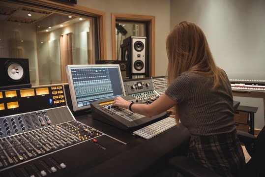 Audio engineer using sound mixer