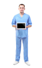 Practitioner in blue uniform holding tablet on white background