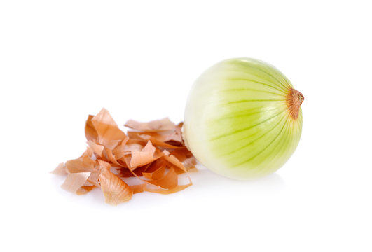 peeled onion and shell on white background