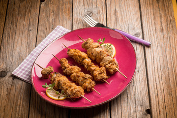 sword fish skewer with lemon and parsley