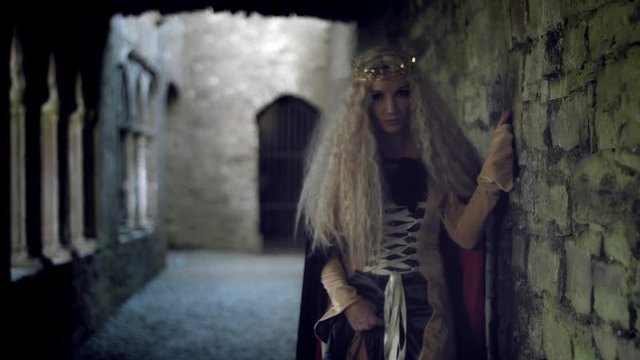 4k Medieval Shot of Game of Thrones Style Queen Posing Dramatic in Castle
