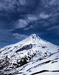 View of the snowy volcano Vilyuchinsky  in Kamchatka
