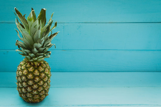 Pineapple on a blue wooden table