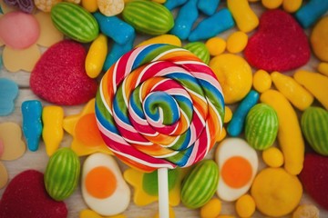Fototapeta na wymiar Round lollipop and many candies