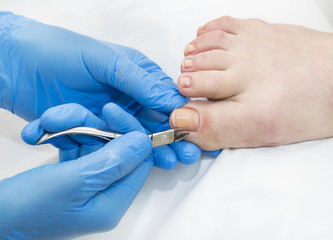 Fototapeta premium Process of pedicure at beauty salon