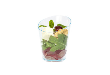 Mini desserts and meat canapes vegetable snacks in plastic cups canaps