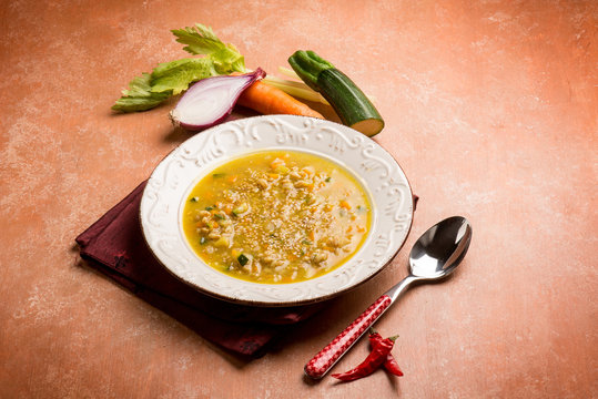 spicy spelt soup with zucchinis carrots and onions