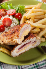 Cutlet Cordon Bleu with pork loin served with French fries and salad