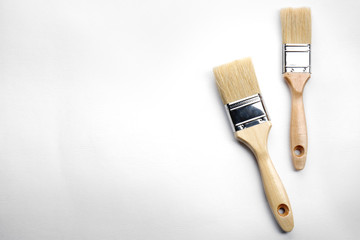 Painting brushes on white textured background