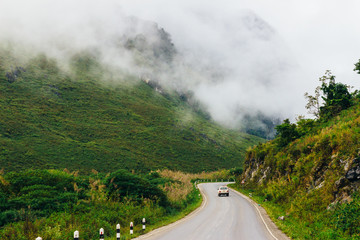 Laos highway - road through Luang Prabang (Luangprabang) Province on a way to Vientiane Province. Road goes through the breathtaking mountains and alpine hills.