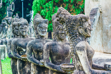 Buddha park in Vientiane, Laos. The landmark of ancient Buddhist stone statues and religious figures
