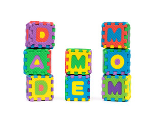 DAD ME MOM shaped by alphabet jigsaw puzzle on white as concept of family