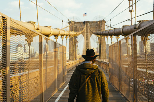 Man walking on bridge