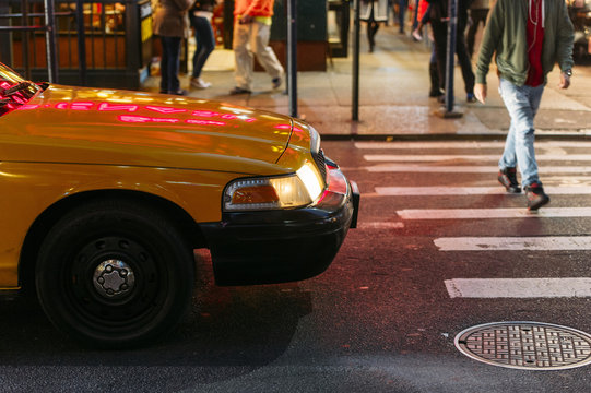 Taxi yielding to a pedestrian