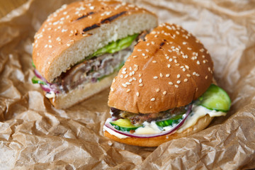 Classic american burgers, fast food on wood background