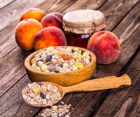 oatmeal in a sac, dried apricots, raisins, grapes, nuts on the b