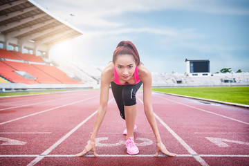 Race Fit and confident woman in starting position