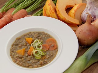 Vegetable lentils soup with pumpkin, carrots and other ingredients.