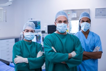 Fototapeta na wymiar Portrait of surgeons standing with arms crossed 