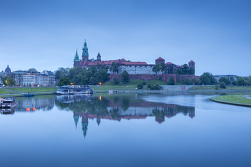 Fototapeta premium blue morning twilight with river and castle
