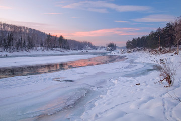 Frozen river/Reflection of the sunset sky in a frozen river. Katun River, Mountain Altai, Siberia, Russia