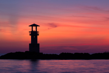 Seascape at sunset. Lighthouse on the coast