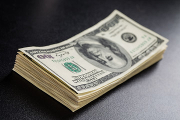 Stack of one hundred dollar bills close-up.