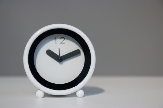White Alarm clock on table with copy space
