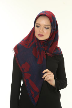 beautiful young muslim women posing in scarf at studio
