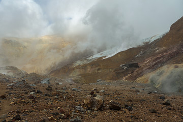 Beautiful slopes Mutnovsky volcano shrouded in clouds.