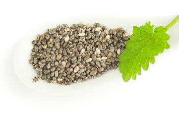 Nutritious chia seeds isolated over a white background