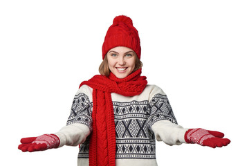 Woman in warm winter clothing with opened arms salutating