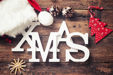 Xmas greeting message on wooden background 