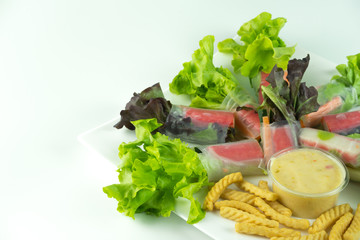 Rolls salad greens on a white background