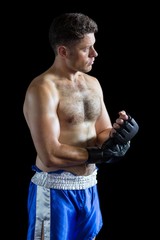 Naklejka premium Boxer wearing grappling gloves 