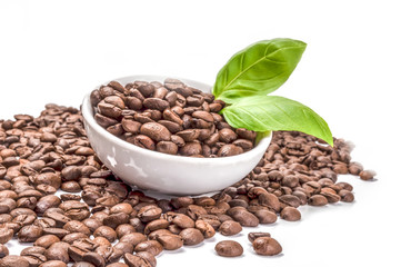 Pile of roasted coffee beans isolated on a white background cutout