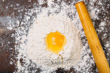 White flour with spinroll on dark background texture photo 